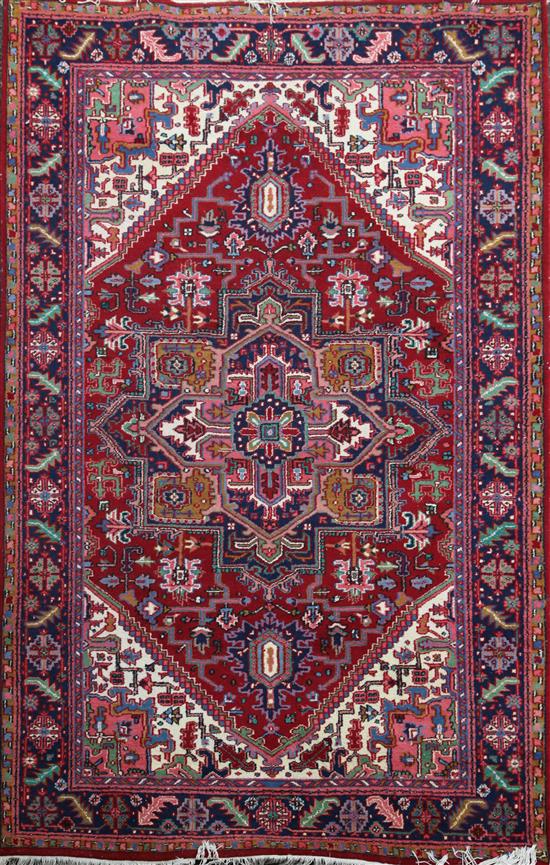 A Heriz carpet, 9ft 6in by 6ft 7in.